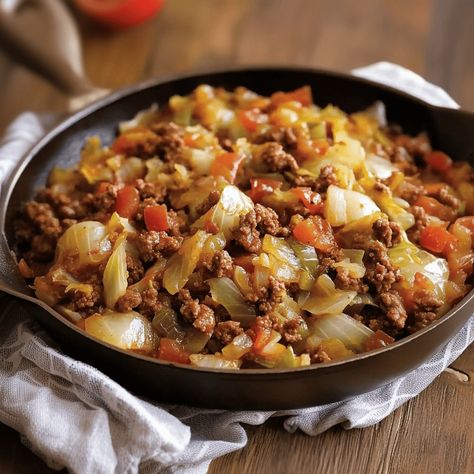 Enjoy a hearty and flavorful meal with this Ground Beef and Cabbage Skillet, a simple yet delicious dish that combines tender cabbage with savory ground beef and a robust tomato-based sauce. This easy-to-make recipe is perfect for a weeknight dinner and is sure to satisfy your cravings for something warm and comforting. Why You’ll Love […] Cabbage And Ground Beef Skillet, Cabbage Tomato Ground Beef, Cabbage And Minced Meat, Hamburger Meat And Cabbage Recipes, Cabbage Beef Bake, Cabbage And Beef Recipes, Cabbage And Hamburger, Ground Beef And Cabbage Recipes, Ground Beef Peppers And Onions