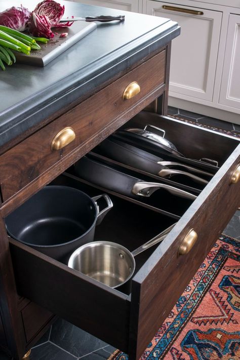 This custom island features several storage ideas. A produce drawer keeps potatoes, onions, and other veggies out of sight and fresh thanks to the mesh door front. A clever spot for pots and pans keeps lids and pans together, organized, and easily accessible. While another drawer with pegs that can be easily arranged keep dishes in order. Studio Dearborn, Dish Drawers, Sarah Robertson, Pot Lid Storage, Kitchen Island Storage, Kitchen Pans, Pan Storage, Enjoy Your Sunday, Of Challenge