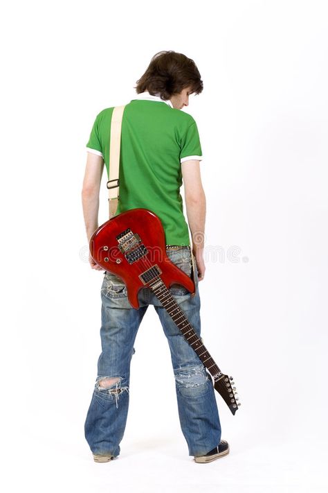 Guitarist with his guitar on back. Guitarist with his guitar on the back #Sponsored , #advertisement, #Ad, #guitar, #Guitarist Art Poses Guitar, Cool Poses With Guitar, Guy Holding Guitar Reference, Guitar Poses For Men, Guitar On Back Pose, Holding A Guitar Reference, Guitarist Reference, Person Holding Guitar Reference, Photography With Guitar