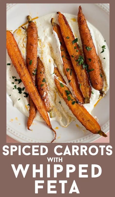 Organic small carrots are tossed with cumin, paprika and cinnamon and then roasted to perfection. Served on top of lemony whipped feta dip. #recipe #carrots #Easter #roasted #spiced #feta #appetizer #side #snack #easy Easter Roast, Carrots With Whipped Feta, Whipped Feta With Carrots, Carrot Appetizers, Feta Carrots, Easter Veggie Side Dish, Carrots Whipped Feta, Whipped Feta Dip With Carrots, Carrots With Feta