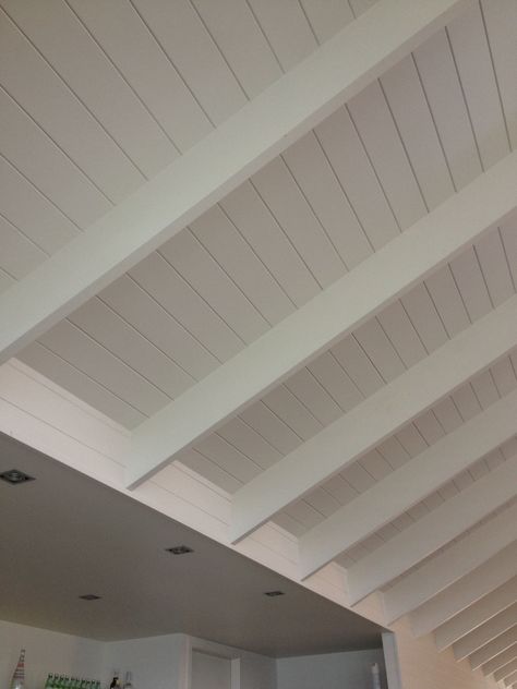 White Timber Raked Ceiling, White Wood Panel Ceiling Bedroom, Roof Panelling Interior, White Timber Ceiling, Roof Beams Ideas, Timber Panel Ceiling, Wood Panelled Ceiling, Ceiling Cladding Ideas, Wooden Rafters Ceiling