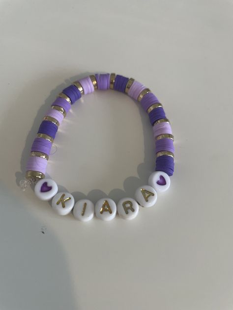 Customised name purple clay bead bracelet Light Purple Clay Bead Bracelet, Cute Purple Bracelet Ideas, Necklace With Beads Ideas, Blue And Purple Clay Bead Bracelet, Clay Bracelet Ideas Purple, Purple Clay Bracelets, Purple Bracelet Ideas Clay Beads, Name Clay Bead Bracelet, Purple Clay Bead Bracelet Ideas