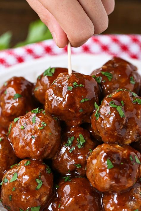 BBQ Party Meatballs are one of our favorite party appetizers! Homemade meatballs that are oven baked and tossed in a sweet and spicy sauce. Bbq Meatball Sliders, Meatball Skewers Appetizers, Bbq Meatballs Baked In Oven, Homemade Bbq Meatballs, Easy Cocktail Meatballs, Barbecue Appetizers, Barbecue Meatball Recipes, Meatballs Sauce Recipe, Party Food Meatballs