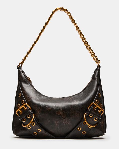 This GRAYA bag is a chic and versatile bag that features a chain shoulder strap for easy carrying. With its moto-inspired distressed design, antique-looking gold hardware, and secure zip closure, this bag is both stylish and functional. Upgrade your outfit with this sleek and modern accessory while staying organized on the go. Chain strap shoulder bag Top zipper closure Buckle and chain detailing Shoulder strap: 10 inches 7.75in H x 9.75in W x 2in D Synthetic materials Duster bag included Import Vintage Designer Shoulder Bags, Cool Shoulder Bags, Black Vintage Shoulder Bag, Trending Things To Buy, Brown Purse Aesthetic, Amazon Must Haves 2024, Modern Chic Fashion, Expensive Bag, Trendy Items