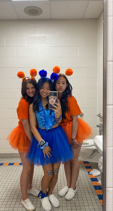 school spirit week, orange school spirit, blue school spirit, friday night lights football, color wars, color tutus, pom pom head bands, mirror picture #schoolspirit #blueout #orangeout #fridaynightlights #football #tutu Blue School Spirit Outfits, Orange And Blue Spirit Day Ideas, Orange And Blue Football Outfit, Blue Color Wars Outfit, Blue And Gold School Spirit Outfit, School Pride Outfit Ideas, Class Color Day Spirit Week Outfits, School Spirit Day Outfits, Blue Out Spirit Day