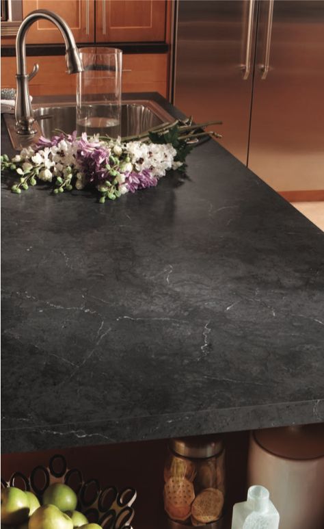 The Black Alicante HPL (High-Pressure Laminate) from Wilsonart’s Marble series featured on this countertop is a perfect subtle dark design for any kitchen or bath design🖤 #modernkitchen #hpl #wilsonart Catani Cabinets is proud to have Wilsonart as one of the suppliers of the high-quality materials we are dedicated to using in every Catani remodel. Learn more about how we revitalize kitchens and baths by checking out our YouTube channel below! 👇 Dark Countertops Laminate, Dark Laminate Countertops With White Cabinets, Black Marble Laminate Countertops, Black Concrete Countertops White Cabinets, Dekton Countertops Black, Black Alicante Laminate Countertops, Dark Formica Countertops, Dark Corian Countertops, Dark Grey Marble Countertops Kitchen