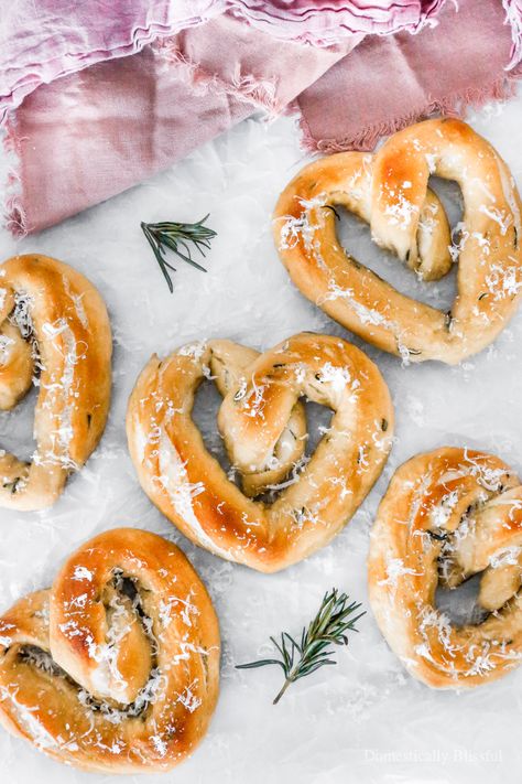 These Heart-Shaped Sea Salt Rosemary Pretzels are perfect for Valentine’s Day as they are soft, salty, and oh so yummy! | Heart-Shaped Sea Salt Rosemary Pretzels - Domestically Blissful | Valentine's Day. | Heart - Shaped Pretzels for Valentine's Day. | Rosemary and Sea Salt Pretzels. | Delicious Twist to Regular Pretzels. | Heart Shaped Savory Treat. | Valentine's Day Baked Treat. | Easy Soft Pretzel Recipe. | Valentine's Day Recipe. | Rosemary, Sea Salt, Pretzel's with a Sprinkle of Parmesan Valentines Gift Basket, Bread Types, Valentines Snacks, Baking Soda Water, Homemade Pretzels, Valentine's Day Treats, Pretzels Recipe, Valentines Day Food, Soft Pretzels