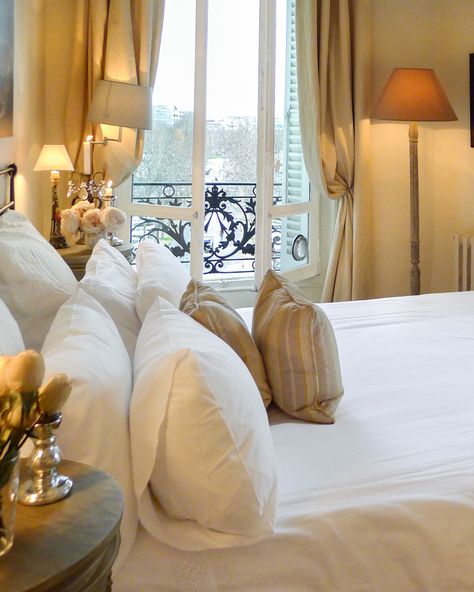 Bedroom With French Windows, The Ritz Paris Bedroom, Window In Corner Of Bedroom, Paris Appartement Aesthetic, Parisian Interior Bedroom, Modern Parisian Bedroom, French Bedroom Ideas, Parisian Style Bedroom, Elegant Bedrooms