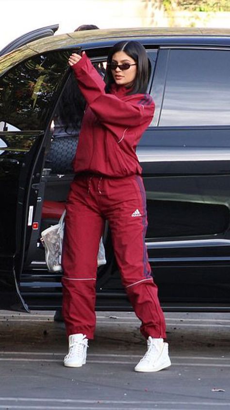 Track suits - These trends are all over social media now, but we'll definitely regret wearing them a few years down the line. Red Tracksuit Outfit Women, Nike Track Suits For Women, Kylie Cars, Adidas Tracksuit Women Outfit, Tracksuit Outfit Women Street Styles, Red Adidas Tracksuit, Tracksuit Outfit Women, Track Suit Outfit, Look Kylie Jenner