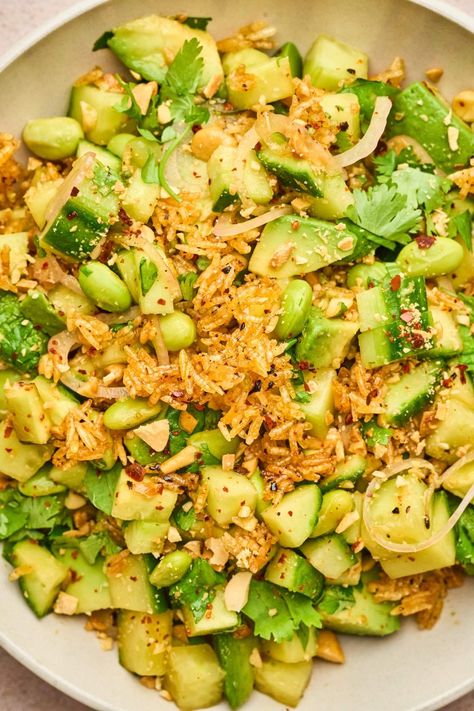 Have you checked out the crispy rice salad that's taking TikTok by storm? It's an Asian-inspired dish that's perfect for using up leftover rice, packed with fresh veggies and herbs along with tasty Asian seasonings. Serve this versatile salad as a light lunch, a tasty side or even make it a hearty main course with your preferred protein. Once you try this crispy rice salad, you’ll find yourself wanting to make it all the time (and always make extra rice so you can make this the next day!) Food To Have With Rice, Crispy Rice Salad With Chicken, Teriyaki Chicken Crispy Rice Salad, Crispy Rice Cucumber Salad, Crunchy Rice Salad, Crispy Rice Salad Recipe, Rice A Roni Salad, Pasta Salad Asian, Crispy Rice Bowl