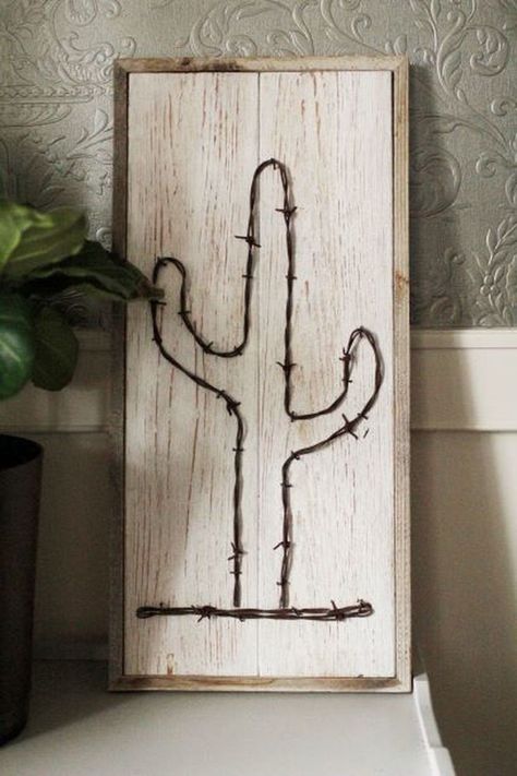 "One of a kind Rustic Cactus, handcrafted from Reclaimed Barnwood using rustic barb wire. Beautifully whitewash background with 1/2\" barnwood border. This is a real conversation piece. Handcrafted in the USA Dimensions 25.25 x 12 x 1 Hanging Hardware included" Wire Cactus, Barb Wire Crafts, Barnwood Frames, Western Wall Decor, Western Bedroom Decor, Barn Wood Picture Frames, Ranch House Decor, Western Rooms, Western Crafts