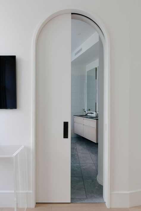 Arched Pocket Door, Manhattan Loft Apartment, Modern Pocket Doors, Brownstone Boys, Modern Door Design, Doors Decoration, Pocket Doors Bathroom, Archways In Homes, Arched Interior Doors