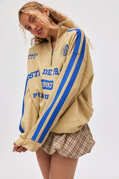 Jet-setting pullover sweatshirt featuring a Coasta De Prato, Portugal graphic across the front. Designed in a slouchy, oversized fit with a half-zip neckline and balloon sleeves topped with stripes for a varsity vibe. Exclusively at Urban Outfitters. Features Costa De Prato graphic half zip sweatshirt Oversized graphic pullover sweatshirt Soft midweight knit Half-zip mockneck with long balloon sleeves with stripe graphcis Costa De Prato, Portugal graphics across the front Relaxed, slouchy fit Tunic length Easy pull-over style UO exclusive Content + Care 50% Cotton, 50% polyester Machine wash Imported Size + Fit Model in Yellow is 5’7" and wearing size Medium Measurements taken from size Medium Chest: 52" Length: 29" | Costa De Prato Graphic Half Zip Sweatshirt in Yellow, Women's at Urban O Vintage Graphic Tees, Women's Graphic Tees, Fitted Tunic, Urban Outfitters Women, Balloon Sleeve Top, Graphic Tees Vintage, Half Zip Sweatshirt, Vintage Graphic, Home Lifestyle