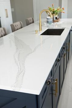 White Cambria Quartz Countertop on Wide Blue Kitchen Island Countertop Concrete, Types Of White, Kitchen With An Island, Bathroom Concrete, White Kitchen Countertops, Glass Countertop, Blue Kitchen Island, Model Dapur, White Granite Countertops