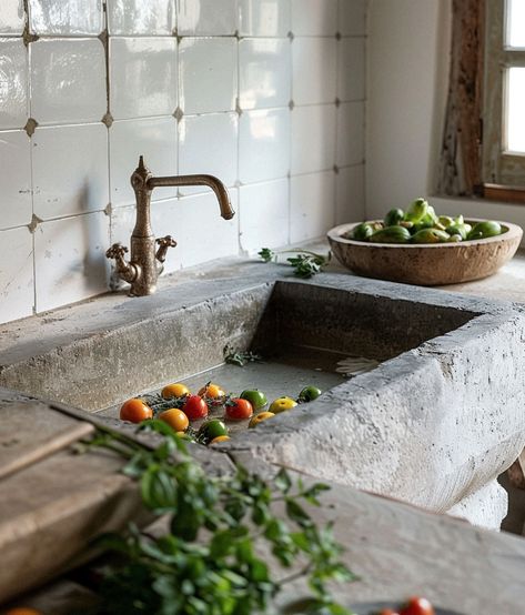 This kitchen tells a story. The worn stone, fresh tomatoes, and the old tap—every detail speaks of a life well-lived. It’s in these simple, unpolished spaces that true comfort and warmth are found. #RusticLiving #SimplePleasures #KitchenStories #SlowLiving #FarmhouseStyle #CozyCorners #TimelessDesign #HomeComforts #EverydayBeauty #MindfulLiving #FreshAndSimple #OldWorldCharm #HeartOfTheHome #CountryLiving #nourishingspaces #raddesigns Kamene Kuce, Monastery Kitchen, Outdoor Garden Sink, Stone Sink Kitchen, Garden Sink, Old Well, Diy Concrete Countertops, Greek House, Artsy Design