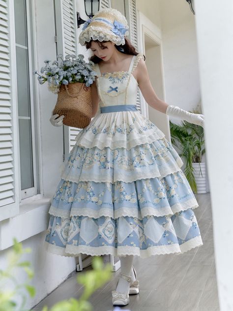 This enchanting piece features a delicate daisy and flower basket print, adding a touch of whimsical charm. The smocked back ensures a comfortable and flattering fit, while the tiered skirt design provides a graceful silhouette. Perfect for tea parties, garden strolls, or any occasion that calls for classic Lolita sophistication. SizeSMLFull Length117-120120-123123-126Bust78-9083-9588-100Waist62-7467-7972-84Hem Circumference330340350 Tiered Skirt Dress, Fluffy Clothes, Tea Party Outfit, Ouji Fashion, Kawaii Outfits, Embroidery Neckline, Daisy Embroidery, Gothic Skirts, Ellowyne Wilde