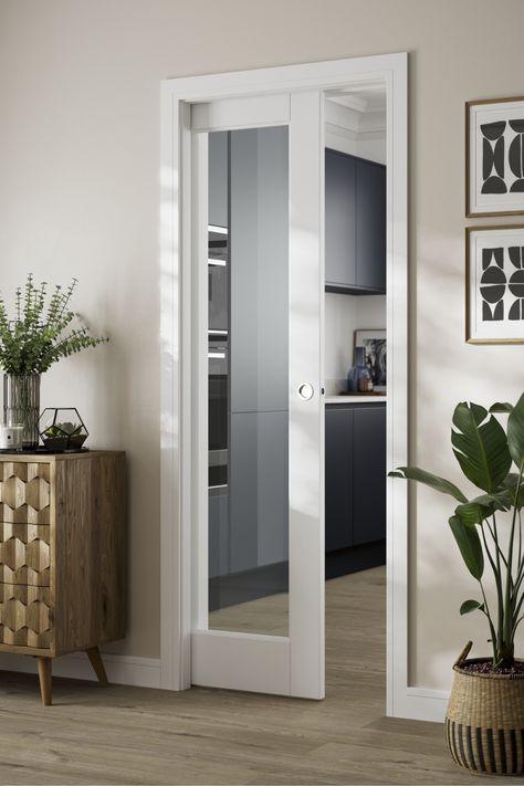 Create a bright and spacious feel by selecting this glazed door. The interiors glass door makes the most of natural light. A sliding door or pocket door is a great way to connect spaces together without making a room feel crowded. The clear, toughened glass of this white doors lets light stream through, whilst the slim border of the white interiors door offers a minimal look that will suit contemporary interiors. The internal door can also be made into a sliding door using a track. Single Sliding Doors Internal, Howdens Internal Doors White, Invisible Sliding Doors Interior, Glazed Sliding Doors Internal, Sliding Pocket Doors Internal, Half Glass Pocket Door, Modern Sliding Glass Doors Interior, Connecting Door Ideas, Study Sliding Door