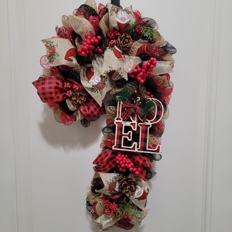 Beautiful Homemade Holiday Deco Mesh Candy Cane Shaped Wreath!! The Wreath Is Composed Of Red, Black, And Tan Deco Mesh Material Wrapped Along A Candy Cane Style Wreath Frame. There Are Holiday Theme Ribbons That Lay On Top Of The Mesh To Give It More Of A Holiday Theme. In Addition, There Are Pine Cone And Red Berries That Accent The Wreath! The Wreath Can Be Hung With Twine That Is Along The Back Side, Which Is Shown In The Pictures Above. When Not In Use, The Twine Can Be Tucked Into The Back Deco Mesh Candy Cane, Mesh Candy Cane, Christmas Wreath Craft, Deco Mesh Wreaths Tutorials, Halloween Mesh Wreaths, Mesh Wreath Tutorial, Red Wreath, Holiday Deco, Candy Cane Wreath