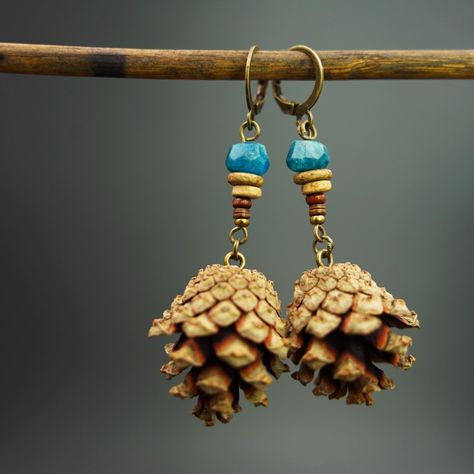 Handmade, with self collected Mini Pine Cones from the Mountains in Italy. I added an Apatite Bead and some Ceramic, Shell and Wood Beads to it. Pinecone Jewelry, Pine Cone Earrings, Pine Cone Jewelry, Mountains In Italy, Mini Pine Cones, Ceramic Shell, Outdoor Girls, Jewelry Workshop, Pine Cone