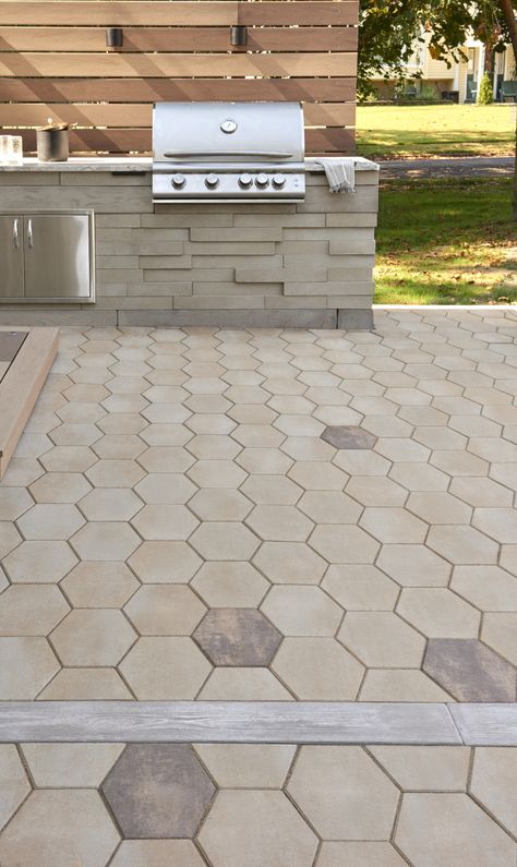 This backyard patio idea is inspired by our Hexa 60 patio slab. Inspired by the traditional hexagon paver, the Hexa 60 adds a modern twist to its predecessor. This patio slab is taking center stage in landscaping, providing a unique geometric look that blends seamlessly in modern outdoor spaces. From patios, to walkways and any other pedestrian-friendly environment, the Hexa 60 will add instant visual appeal to any exterior! Check out our website to shop the look! Hexagon Paver Patio Ideas, Hexagon Patio Ideas, Hexagon Outdoor Pavers, Hexagon Walkway, Hexagon Patio, Outdoor Patio Flooring Ideas, Diy Stone Patio, Driveway Lights, Diy Concrete Patio