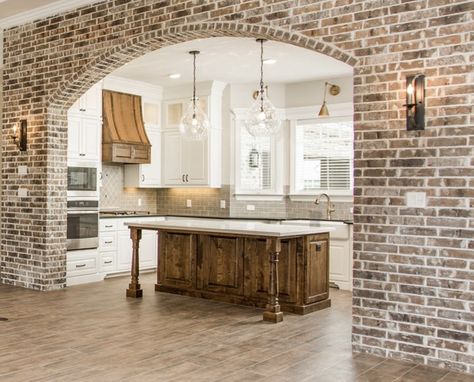 Arched brick wall between LR and kitchen Wide Oak Flooring, Archways In Homes, Brick Archway, Brick Accent Wall, Dreams To Reality, Brick Arch, Brick Kitchen, College Station, Farmhouse Interior