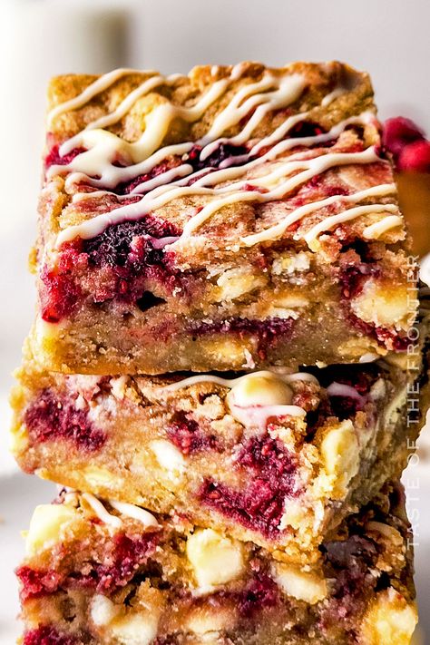 Raspberry White Chocolate Blondies are heavenly. Tangy raspberries and creamy white chocolate, baked into moist, chewy blondie perfection. White Chocolate Raspberry Brownies, Raspberry And White Chocolate Blondies, Raspberry Blondies Recipe, White Chocolate Raspberry Blondies, White Chocolate Raspberry Bars, White Chocolate Raspberry Desserts, Frozen Raspberry Recipes, Raspberry Blondies, Dessert Favorites