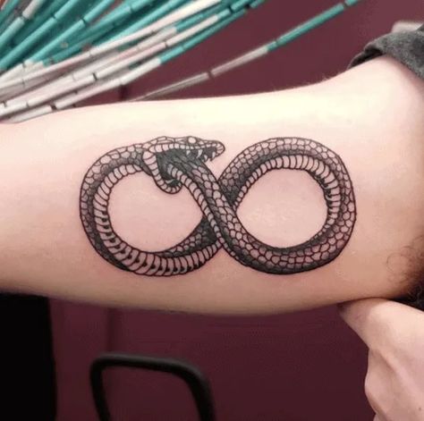 Snake Tattoo Designs & Meanings [2020 Guide] - Tattoo Stylist Infinity Snake, Snake Tattoo Ideas, Infinite Tattoo, Snake Tattoo Meaning, Traditional Snake Tattoo, Small Snake Tattoo, Daisy Tattoo Designs, Eye Tattoos, Ouroboros Tattoo