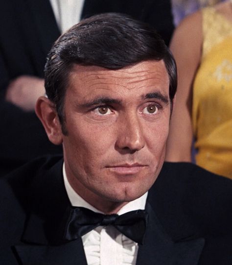 George Lazenby is James Bond 007 in "On Her Majesty's Secret Service". Personally, I never cared from Lazenby as Bond. However, I think the movie had great action sequences. If you are a fan of George Lazenby, please like or pin a few photos. James Bond Characters, James Bond Actors, Famous Legends, George Lazenby, Bond Series, Movie Studios, 007 James Bond, Ian Fleming, James Bond Movies