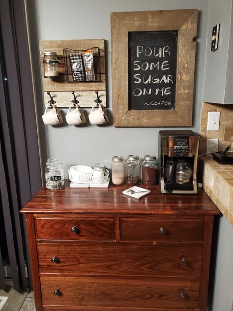 Coffee bar made with an old dresser, mason jars, chalk board and wall hanging for mugs Mason Jar Coffee Bar, Coffee Bar From Dresser, Antique Dresser Coffee Station, Repurposed Dresser To Coffee Bar, Old Dresser Into Coffee Bar, Coffee Bar From Antique Dresser, Coffee Bar Home, Old Dressers, Vintage Kitchen Decor