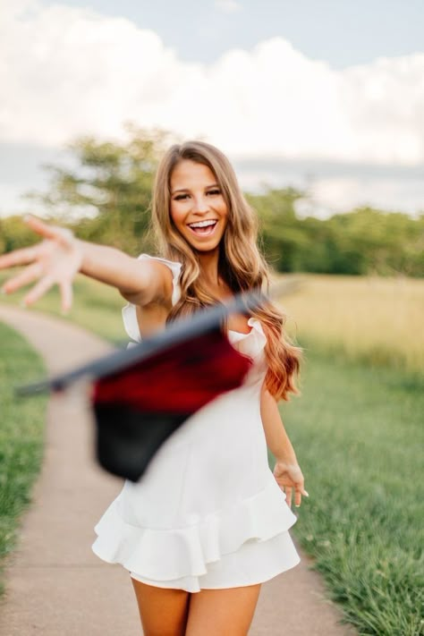 Graduation Picture High School, Grad Pics With Cap And Gown, Senior Cap N Gown Pictures, Senior Cap Picture Ideas, Outside Cap And Gown Pictures, Grad Cap Pictures Senior Photos, Senior Photos At High School, Cap And Gown Senior Pictures In A Field, Graduation Photos Cap And Gown