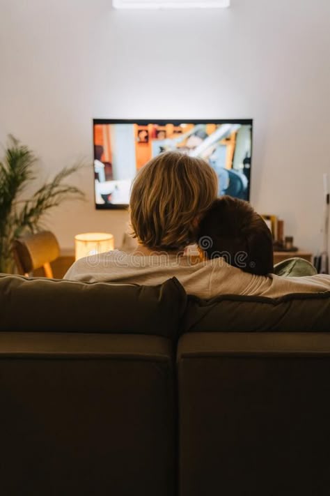 Young gay couple hugging and resting on couch while watching tv royalty free stock images Couple Hugging On Couch, Couple Watching Movie On Couch, Couples Watching Tv, Couple Watching Tv Aesthetic, Couple On A Couch, Couple Watching Tv, Watching Tv Together, Body References, Christian Relationships