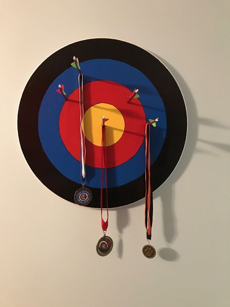 Archery medal hanger or display Archery Medal Display, Archery Snacks, Nasp Archery, Archery Decor, Medals Aesthetic, Archery Crafts, Archery Medal, Medal Display Ideas, Archery Photography