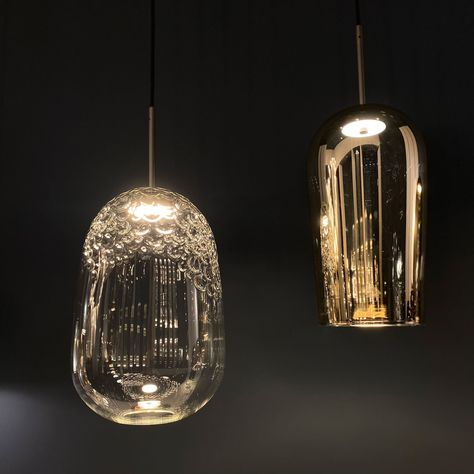 The Galuchat Pendant features a Transparent hand-blown glass shade with an opaque anthracite metal painted frame. The precious handwork made it possible to obtain an irregular texture reminiscent of the manufacturing of shark-tanned leather, also called galuchat from the name of its first user, Jean-Claude Galuchat, a French craftsman at the service of King Louis XV. Made in Italy. Note: A remote dimmable power supply can be purchased separately below. Task Lamp Desk, Outdoor Chandeliers, Feather Duster, Sconces Bedroom, Outdoor Table Lamps, Lighting Design Interior, Bathroom Wall Sconces, Kitchen Pendants, Arc Floor Lamps