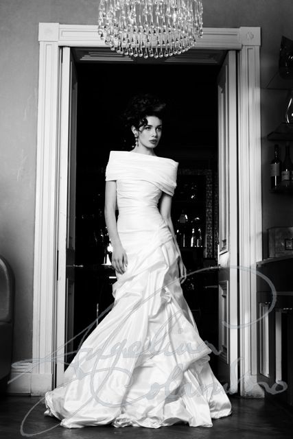 Couture bridal designer Angelina Colarusso, renowned for elegance and glamour, outstanding corsetry, timeless design and signature 1950s body draping . Each gown capturing the very spirit of vintage silver screen and the timeless elegance of the worlds most unforgettable women. The dramatic and sophisticated Mira wedding dress by couture bridal designer Angelina Colarusso. #offtheshoulderweddingdress #corsetedweddingdress #weddingdresswithcorset #vintagestyleweddingdress #vintagehollywoodstyle Angelina Colarusso, Wedding Dresses London, A Wedding Dress, Wedding Dress Couture, Couture Wedding, Elegant Wedding Dress, Bridal Designs, Gorgeous Gowns, Bridal Couture