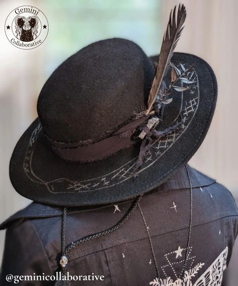 New addition to our wearable art collection! With it's black monochrome design, hand burned snake, smoky quartz, and crows feather, this hat is sure to turn some heads. Available Sunday October 13 at River City Witches Samhain Market!!! Black Brimmed Witchy Costume Hat, Feather Witch Hat, Black Witchy Brimmed Hat, Black Brimmed Hat With Feathers, Gothic Black Brimmed Hat, Crow Feather, Hand Burn, Monochrome Design, Smoky Quartz