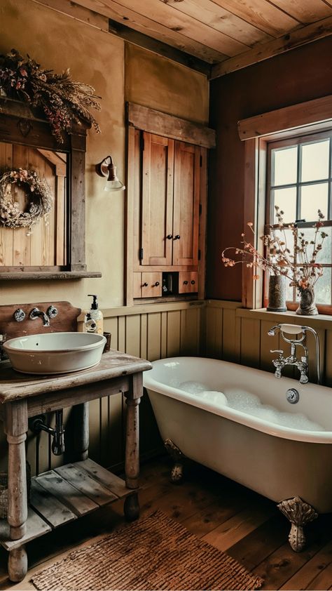 Discover charming ideas to add a rustic touch to your bathroom decor. Explore cozy and inviting designs that bring warmth and character to your space. From reclaimed wood accents to vintage fixtures, these rustic bathroom decor inspirations will create a relaxing retreat in your home. Embrace the timeless beauty of natural elements and earthy tones for a serene atmosphere in your bathroom. Tiny Cabin Bathroom Ideas, Copper And Wood Bathroom, Country Farm Bathroom, Early American Bathroom, Old Cottage Bathroom, Rustic Sink Bathroom, Moody Rustic Bathroom, Mountain Bathroom Decor, Vintage Cabin Bathroom