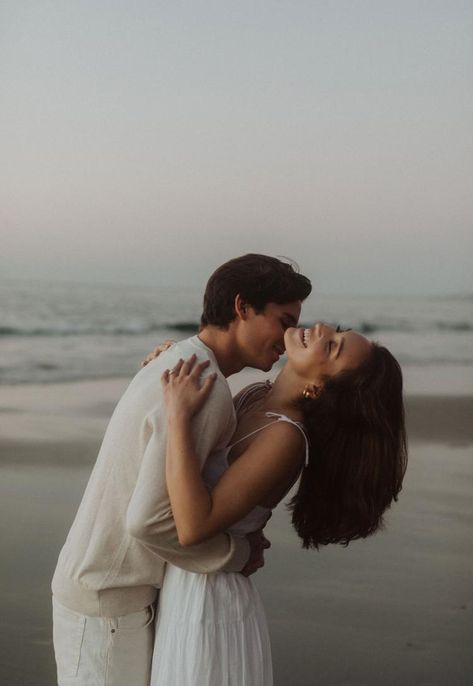 Engagement-couple’s-session-in-San-Diego,-California.-The-beach-shoot-used-grainy,-blurred,-and-warm-photography-to-capture-love-through-storytelling. Blue Hour Beach Photoshoot, Ocean Couple Photoshoot, Beach Couple Pictures Photography, Sunrise Beach Photoshoot Couple, Beach Picnic Engagement Photos, Sunrise Couple Photography, Wedding Photoshoot Beach, Beach Photoshoot Couple, Seaside Photoshoot