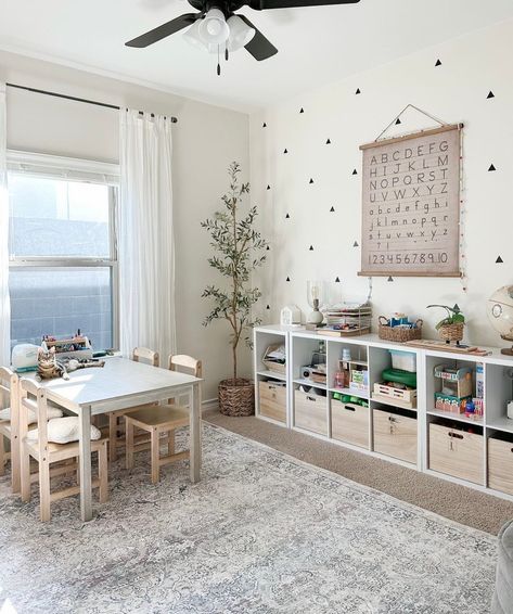 Even the simplest of decals can make all the difference! 🔺 📸: @arlynmdesigns Playroom Refresh, Playroom Art Corner, Sibling Playroom, Easy Cheap Playroom Ideas, Basement Toy Area, Playroom Ideas Neutral, Calming Playroom, Toddler Basement Playroom, Living Room And Playroom