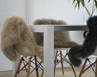 Sheepskin rugs for dining chairs genuine superior sheepskin for a nordic look. Create hygge! Dining Room Chair Slipcovers, White Dining Room Chairs, Thrown Chair, Dining Room Chair Covers, White Dining Room, Faux Leather Dining Chairs, Dining Chair Covers, Sheep Skin, Sheepskin Rug