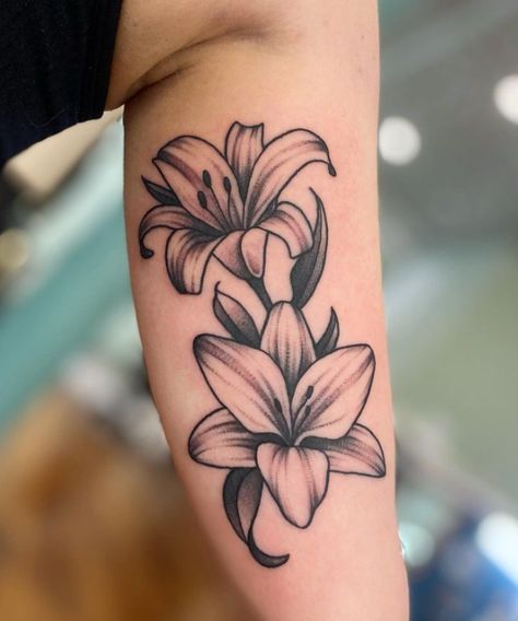 Lily Tattoo Drawing, 3 Lily Tattoo Design, Traditional Lilly Tattoos, Cala Lilly Tattoo For Women, Lily Chest Tattoo Female, Black Lillies Tattoo, Day Lilies Tattoo, Shaded Lily Tattoo, Lily Tattoo For Men