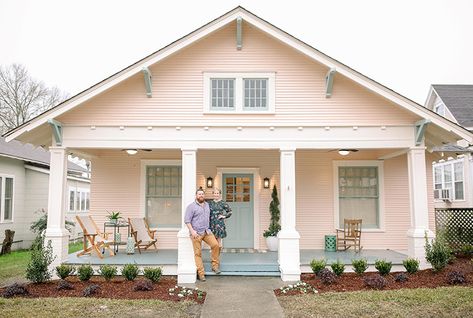 When Erin Napier shared her vision for a blush pink bungalow with seafoam-green trim, we'll admit we were a little (OK, more like majorly) skeptical, but seeing the finished result of this polished craftsman heritage home, after an extensive $109,000 renovation, we'll never question Erin again! See how she and husband Ben converted this forgotten bungalow into a teacher's dream home. Watch Home Town Sundays at 9PM e/p and stream Live and On Demand on the new Global TV App, and on STACKTV wit White House Pink Front Door, Pastel Home Exterior, Pink Bungalow Exterior, Blush Exterior House, Peach Pink House Exterior, Soft Pink House Exterior, Pink House Green Shutters, Peach House Exterior Color Schemes, Pale Pink House Exterior