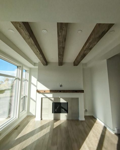 Adding warmth to this new build with some reclaimed beams and mantel . #mantel #reclaimedwood #ceilingbeams #reclaimedbeams #reclaimedmantel Vaulted Ceiling Beams, Reclaimed Beams, Ceiling Beams, Vaulted Ceiling, New Build, New Builds, Reclaimed Wood, Beams, Ceiling