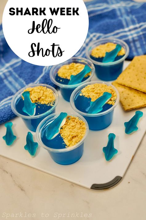 Shark Week Jello Shots are the perfect addition to shark week! All you need is blue jello, vodka, gummy sharks, graham crackers and you have a fun adult treat to enjoy! Want the kids to enjoy shark week too? Make these jello shots with no alcohol! Blue Jello, Refreshing Snacks, Summer Cookouts, Frozen Cocktails, Best Cocktail Recipes, Summer Barbecue, Jello Shots, Trending Recipes, Party Food And Drinks