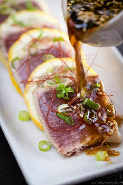 Tuna Tataki Recipe キハダ鮪のたたき - Pan seared sashimi grade tuna drizzled in a refreshing ginger ponzu sauce and finish off with sesame seeds, this tuna tataki recipe is a delicious treat for seafood lovers! #tatakirecipe #tunatatakisauce #asianseafoodrecipes #seafoodrecipesappetizers #tunarecipes #freshtunarecipes #japanesefood #asianrecipes #sashimituna #searedtuna | Easy Japanese Recipes at JustOneCookbook.com Tuna Tataki, Just One Cookbook, Easy Japanese Recipes, Seared Tuna, Mapo Tofu, Tuna Recipes, Sushi Recipes, Think Food, Japanese Recipes