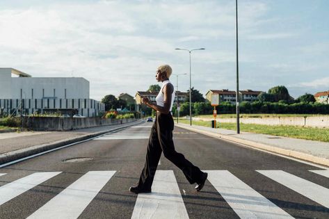 Woman using mobile phone while crossing street in city stock photo Street Crossing, Crossing The Street, Live Your Truth, Branding Shoot, Talk Therapy, Stomach Problems, Lack Of Motivation, Mental Health Care, Daily Walk