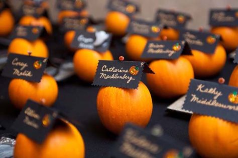 Pumpkin Escort Cards    Attach your escort cards to mini pumpkins. Add even more flair with a jack-o'-lantern sticker. Classy Halloween Wedding, Fall Wedding Seating, Bricolage Halloween, Classy Halloween, Halloween Themed Wedding, Fall Wedding Photos, Pumpkin Wedding, Wedding Themes Fall, Bridal Guide