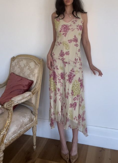 A beige dress with asymmetrical hemline and stitching, featuring a green and pink paisley floral pattern and stunning silver sequins. Fully lined. 100% silk with a polyester inner lining size: Tag says 12 (we think it fits like a M/L) model is 5’7” with a 26” waist and a C bust 90’s Dresses, Mini Birthday Dress, Green And Pink Dress, Cocktail Party Attire, Gilmore Girls Outfits, Silk Dress Vintage, Cocktail Outfit, Beige Dress, Green Dresses