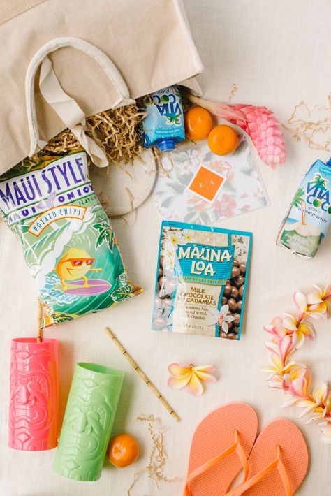 Hula on over to this tropical Maui wedding because it is STOCKED with seaside wedding. Coral + honey hues mingle with deep green monstera leaves in this wedding decor that does not quit! We could spend all day looking at details like this wedding welcome bag, but for now, we will pass the baton onto you! #ruffledblog Tropical Welcome Bags, Hawaii Welcome Bags, Hawaii Wedding Welcome Bags, Tropical Bridal Party, Welcome Bag Ideas, Tropical Wedding Favor, Practical Wedding Favors, Tropical Wedding Bouquets, Tropical Weddings