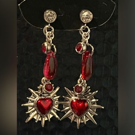 Add A Touch Of Elegance To Your Outfit With These Stunning Sacred Hearts Dangle Drop Earrings. Handmade With Care, They Feature Delicate Hearts That Dangle Gracefully With Blood Red Gem Accents. Perfect For Any Occasion, They Are Sure To Draw Compliments And Make A Lasting Impression. Gothic Heart Art, Red Heart Accessories, Hua Cheng Earring, Red Drop Earrings, Gold Red Jewelry, Red And Silver Aesthetic, Red Wedding Accents, Red Stone Jewellery, Red Accessories Outfit