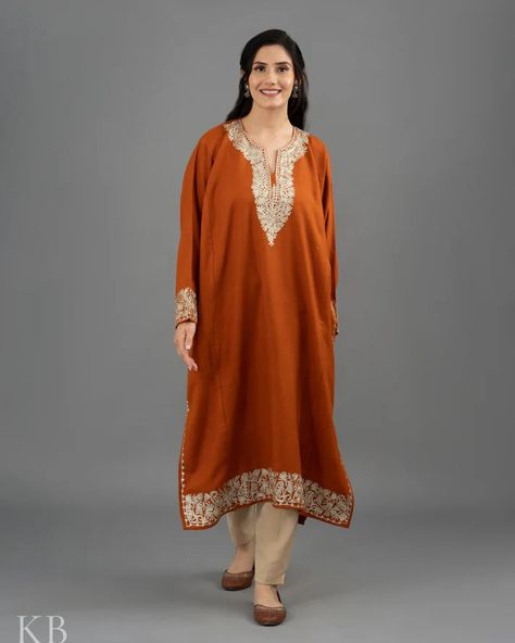 https://tinyurl.com/bdcwcme4 Zari Embroidered Orange Cashmilon Phiran Product Details Fabric - Fine Cashmilon Color - Rust Orange Care - Dry Clean Wash Embroidery - Kashmiri Zari Embroidery Type - 2 Side Pockets Time To Make - 10-15 Days COD - Available The bright and vivid silver zari embroidery adorns on a wonderful rust orange coloured fine cashmilon base. You can pair it with jeans or palazzos and turn heads wherever you go! #amritsarbridal #punjabibridaljewellery #punjabibridals #punj... Phirans Kashmiri, Kashmir Dress, Embroidered Orange, Kurti Style, Zari Embroidery, Red Embroidery, Embroidered Wool, Jammu And Kashmir, Velvet Color